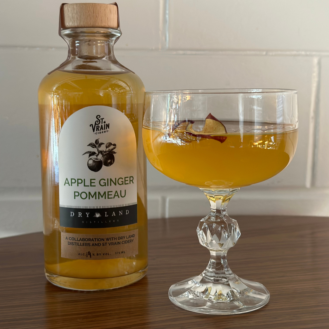 Pommeau ginger cocktail beside a community collaborative apple ginger pommeau made by Dry Land Distillers and St. Vrain Cidery